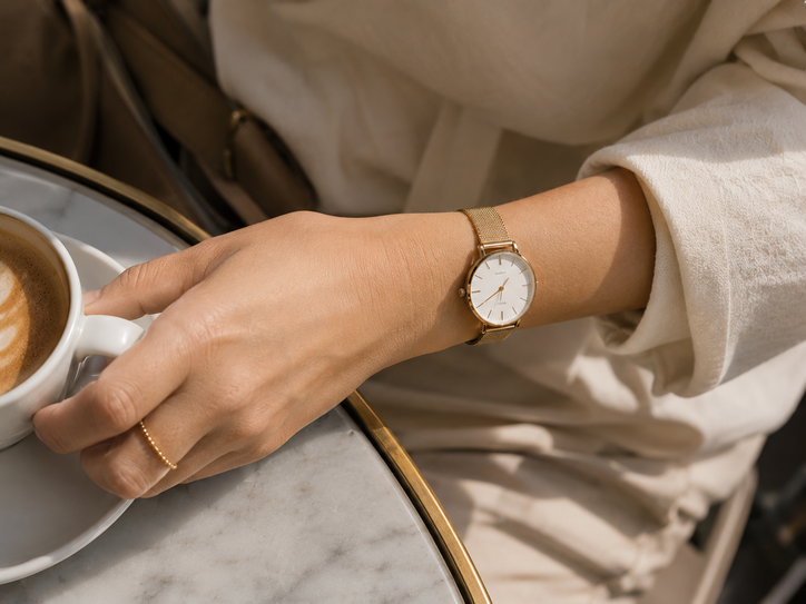 minimalist gold watch and ring aesthetic