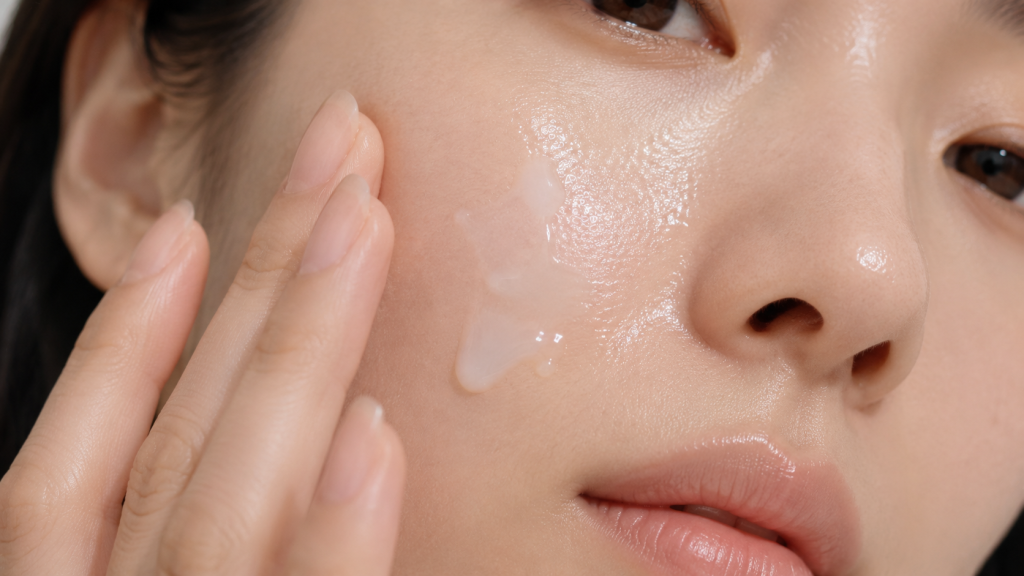 Applying hydrating essence for dewy glowing skin