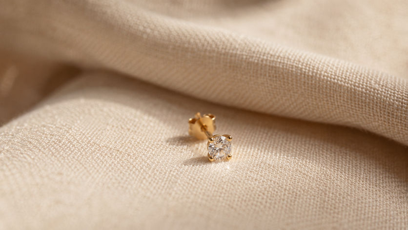 delicate diamond solitaire stud earring